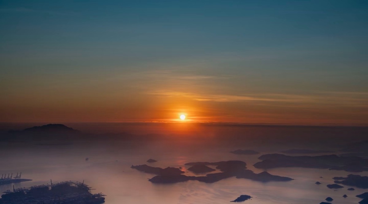 Sunrise from the top of Wutong Mountain, looking over the bay and container port