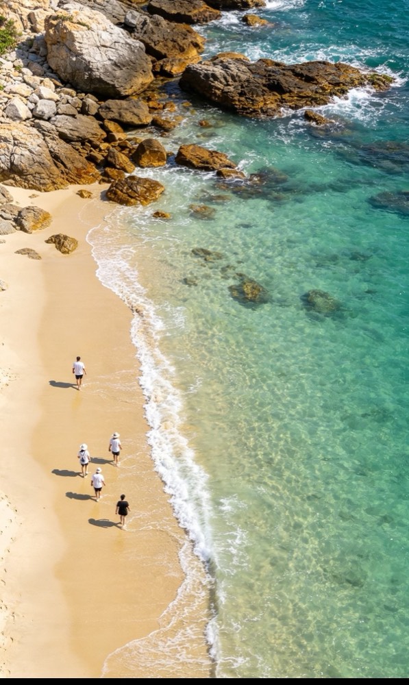 Clear turquoise water and rocks at Yangmeikeng beach, seen from above